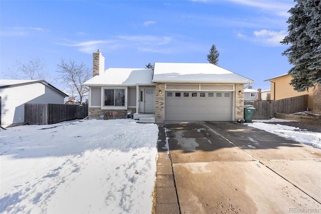 ranch-style house with driveway, a chimney, an attached garage, and fence