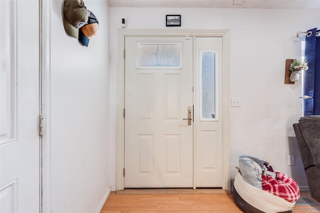 foyer featuring light wood-style flooring