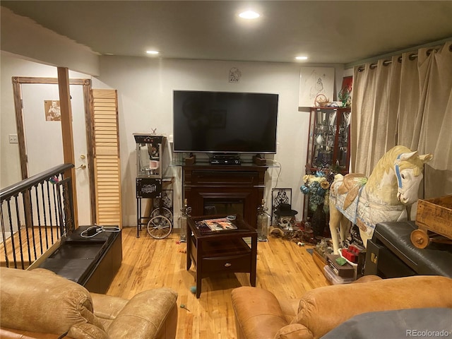 8741 Faraday St, Denver, CO 80229 - living area featuring wood finished floors and recessed lighting