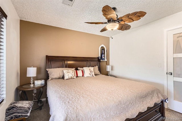 15685 E 50th Ave, Denver, CO 80239 - carpeted bedroom with a textured ceiling, visible vents, and ceiling fan