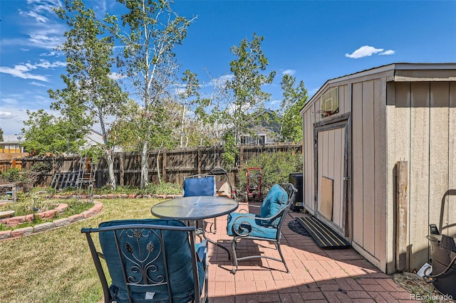 15685 E 50th Ave, Denver, CO 80239 - view of patio with a fenced backyard, a storage shed, and an outdoor structure