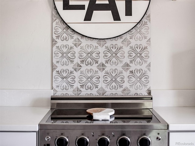 interior details featuring stove and light countertops