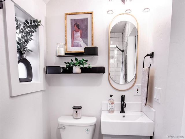 bathroom featuring a sink and toilet