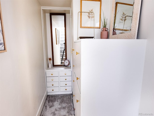 interior space featuring carpet floors and baseboards