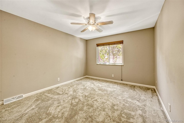 carpeted empty room with ceiling fan