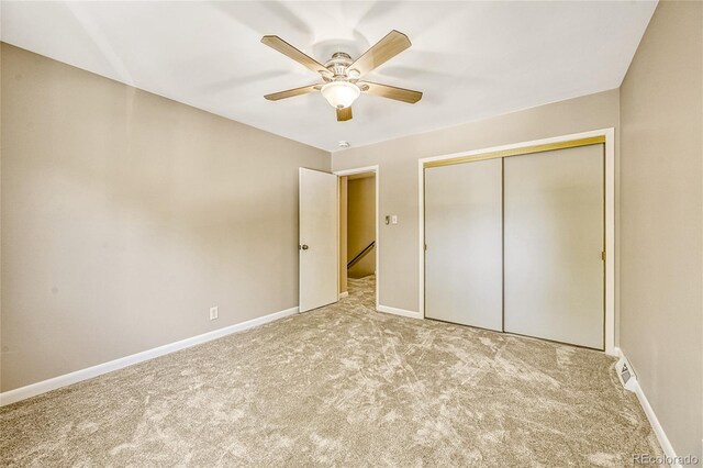 6885 E Arizona Ave Unit D, Denver, CO 80224 - unfurnished bedroom with carpet flooring, a closet, baseboards, and ceiling fan