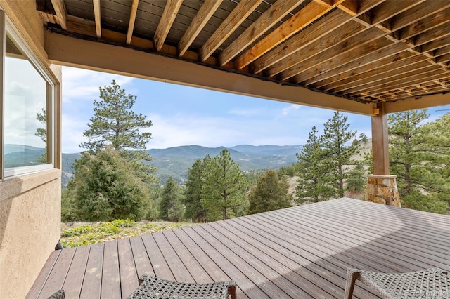wooden deck featuring a mountain view