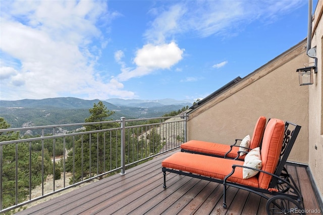 wooden terrace with a mountain view