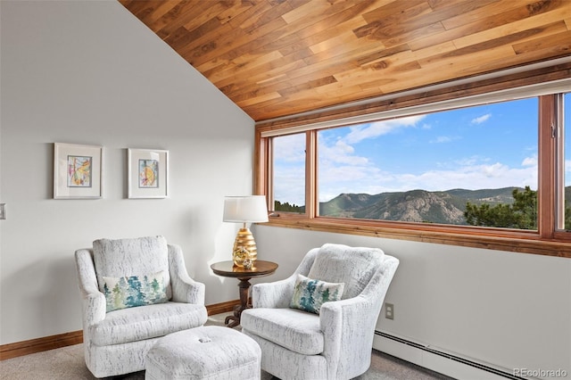 sitting room with vaulted ceiling, baseboards, wood ceiling, a mountain view, and baseboard heating