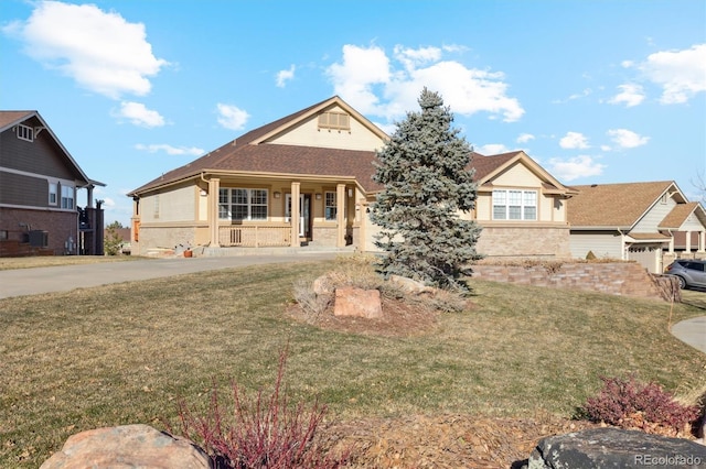 view of front of home featuring covered porch and a front yard