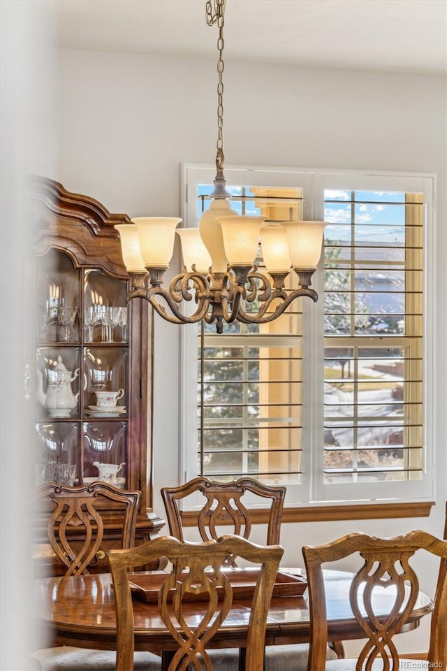 dining space featuring a chandelier