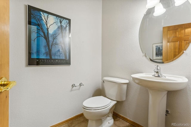 bathroom featuring tile patterned floors and toilet