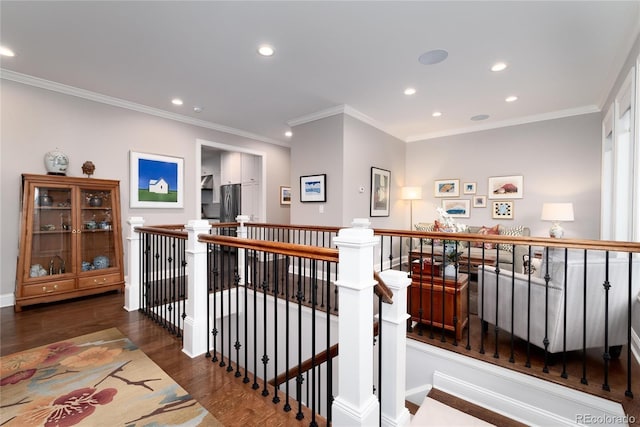 hall with ornamental molding and dark hardwood / wood-style floors