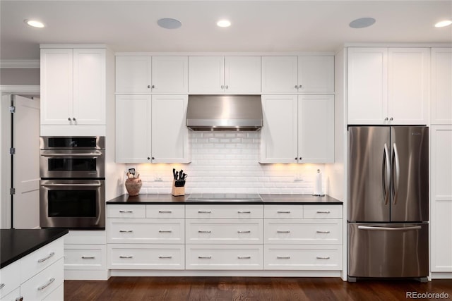 kitchen featuring white cabinetry, appliances with stainless steel finishes, dark hardwood / wood-style flooring, range hood, and backsplash