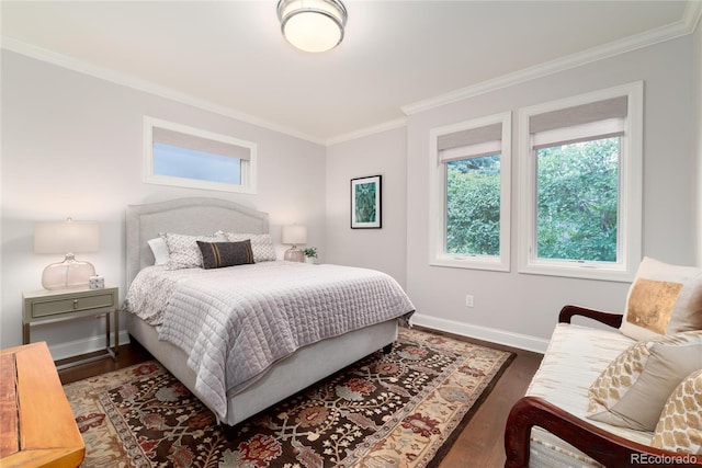 bedroom featuring crown molding and dark wood-type flooring