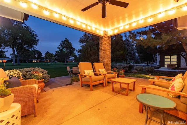 patio terrace at dusk with outdoor lounge area and ceiling fan