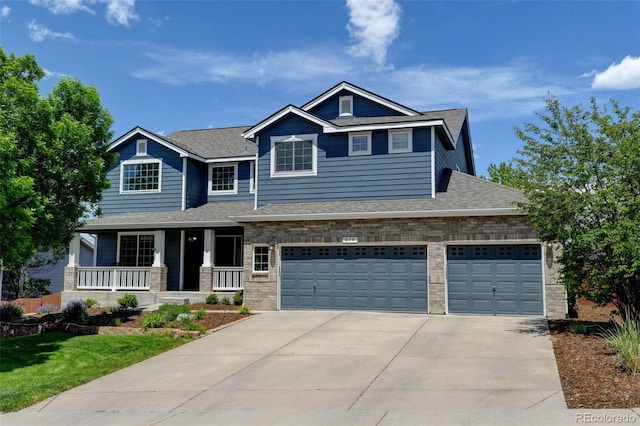 879 Quintana Ln, Erie, CO 80516 - craftsman-style home featuring a porch, concrete driveway, a shingled roof, and brick siding