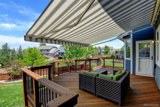 879 Quintana Ln, Erie, CO 80516 - wooden deck with an outdoor hangout area and a residential view