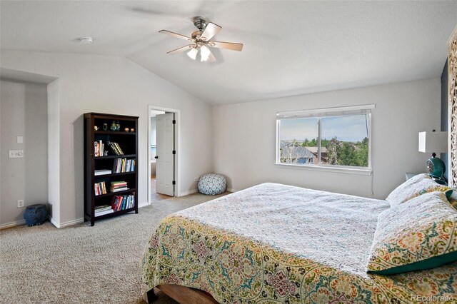 879 Quintana Ln, Erie, CO 80516 - carpeted bedroom featuring lofted ceiling, baseboards, and a ceiling fan