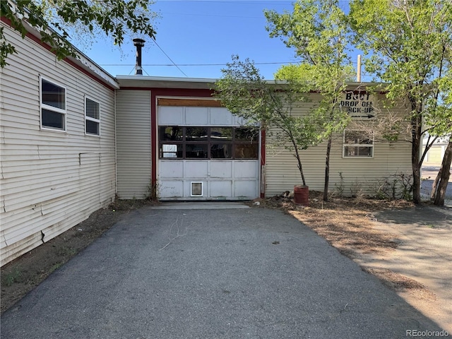 211 Oak St, Salida, CO 81201 - view of side of property featuring asphalt driveway