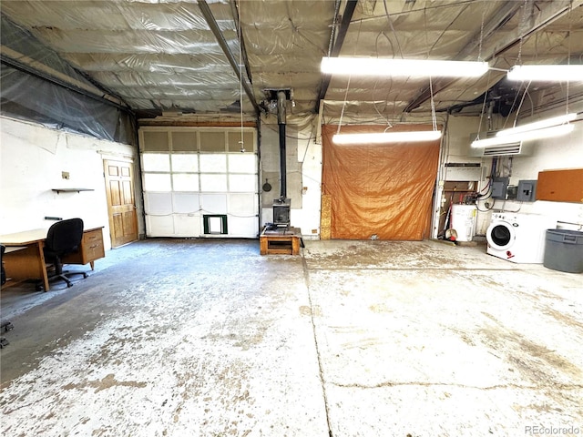 211 Oak St, Salida, CO 81201 - garage featuring electric panel, a desk, washer / clothes dryer, and electric water heater