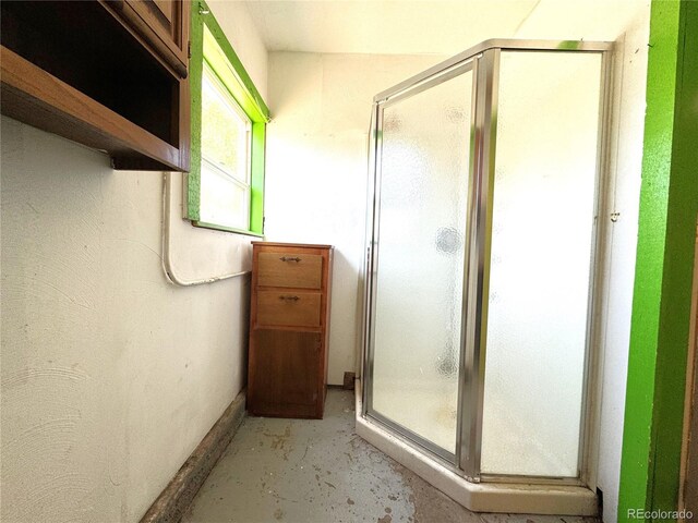 211 Oak St, Salida, CO 81201 - bathroom featuring a stall shower and unfinished concrete flooring