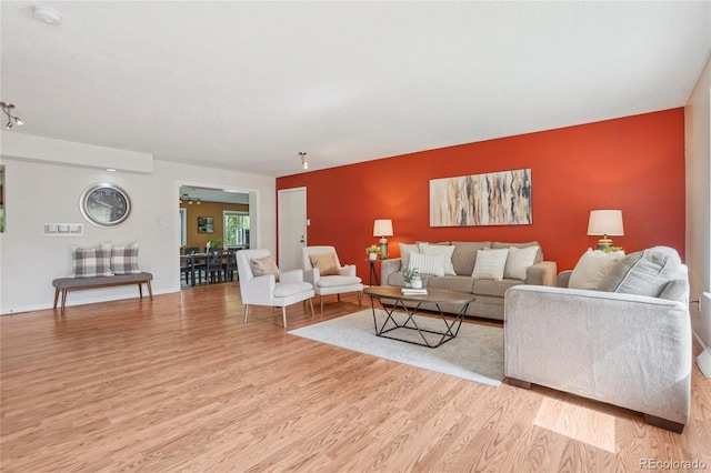 2173 S Ouray St, Aurora, CO 80013 - living area with light wood-type flooring and a ceiling fan