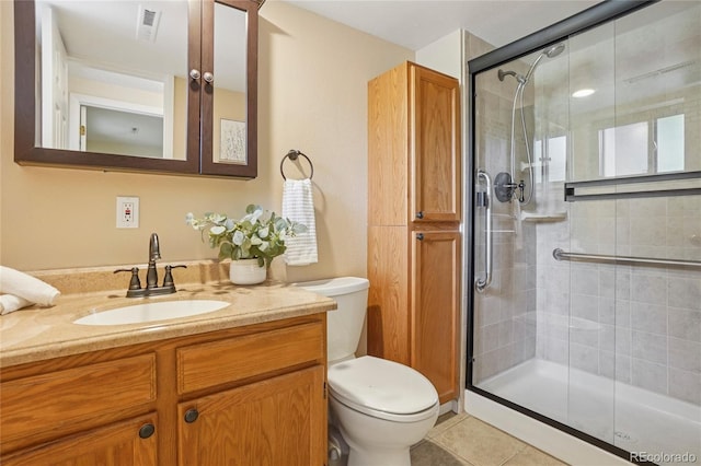 2173 S Ouray St, Aurora, CO 80013 - bathroom with a shower stall, vanity, and tile patterned flooring