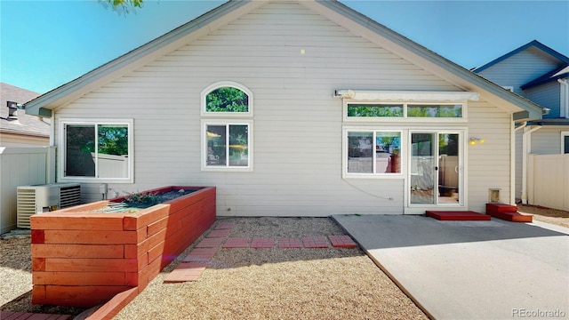 back of house featuring a patio, central air condition unit, and fence