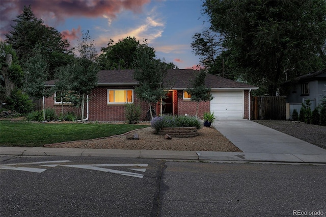 4465 Zephyr St, Wheat Ridge, CO 80033 - ranch-style house featuring brick siding, driveway, and a garage