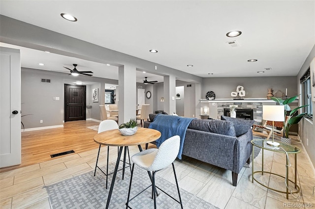 4465 Zephyr St, Wheat Ridge, CO 80033 - living area with a ceiling fan, a stone fireplace, and recessed lighting