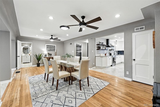 4465 Zephyr St, Wheat Ridge, CO 80033 - dining space with ceiling fan, light wood finished floors, and recessed lighting