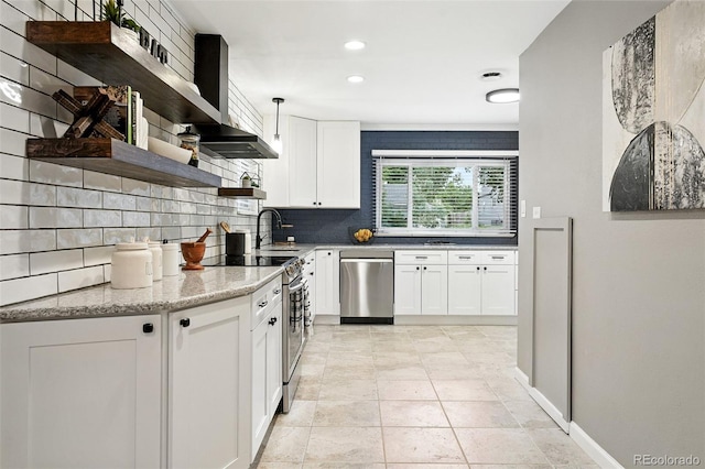 4465 Zephyr St, Wheat Ridge, CO 80033 - kitchen with appliances with stainless steel finishes, open shelves, decorative backsplash, white cabinets, and recessed lighting