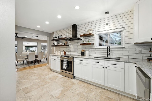 4465 Zephyr St, Wheat Ridge, CO 80033 - kitchen with stainless steel appliances, wall chimney exhaust hood, open shelves, tasteful backsplash, and light stone countertops