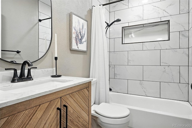 4465 Zephyr St, Wheat Ridge, CO 80033 - bathroom featuring vanity, shower / bath combo with shower curtain, and a textured wall