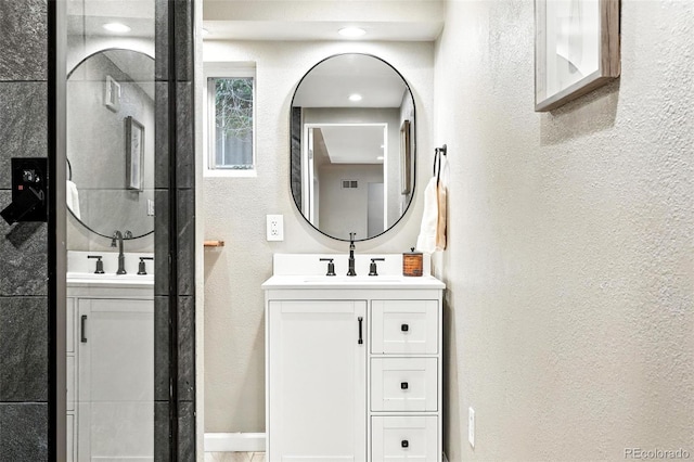 4465 Zephyr St, Wheat Ridge, CO 80033 - full bathroom featuring vanity and a textured wall