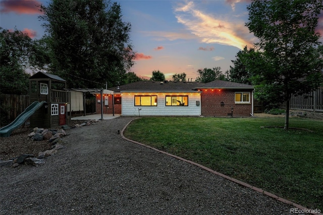 4465 Zephyr St, Wheat Ridge, CO 80033 - single story home featuring gravel driveway and a playground