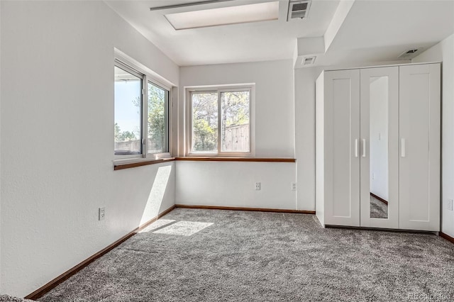 unfurnished bedroom with visible vents, baseboards, and carpet floors