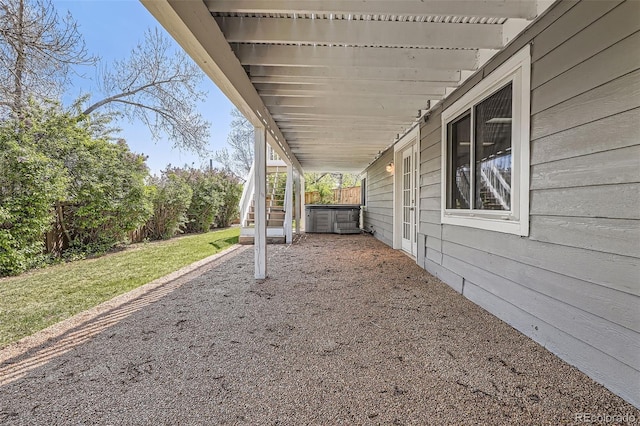 view of yard featuring a patio and a jacuzzi