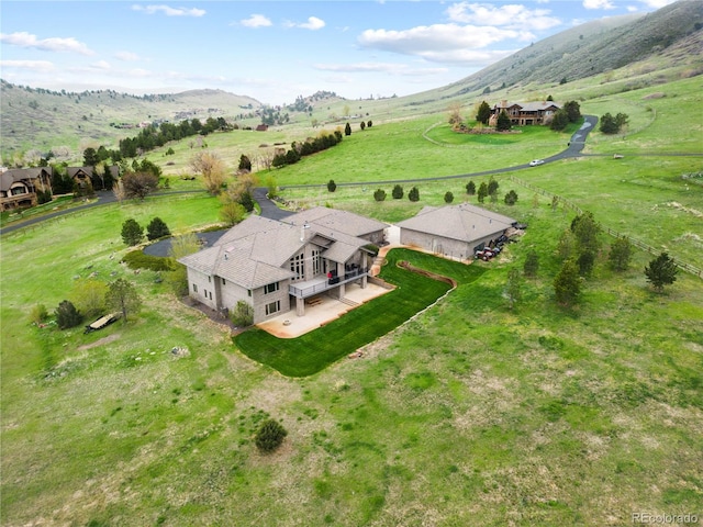 bird's eye view featuring a mountain view and a rural view