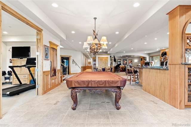 recreation room with a notable chandelier and pool table