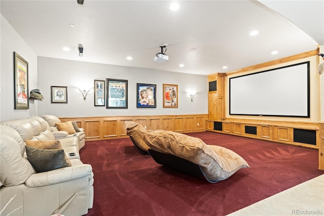 cinema room featuring dark carpet