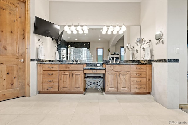 bathroom featuring vanity and tile patterned flooring