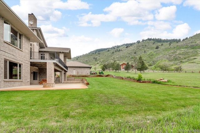 5881 Deer Meadow Trl, Golden, CO 80403 - view of yard with a balcony, a patio, and a mountain view