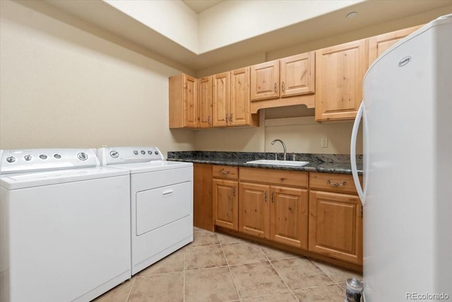 5881 Deer Meadow Trl, Golden, CO 80403 - laundry room with washing machine and dryer, light tile patterned floors, and cabinet space
