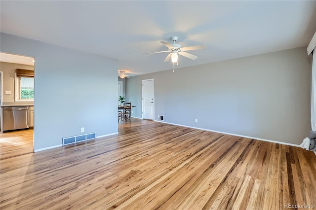 empty room with light hardwood / wood-style flooring and ceiling fan