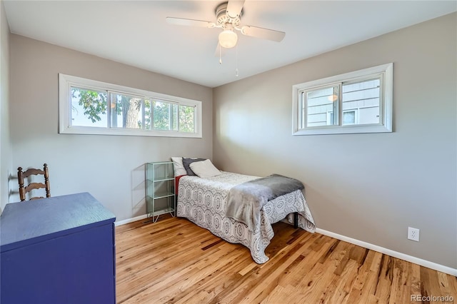 bedroom featuring light hardwood / wood-style flooring and ceiling fan