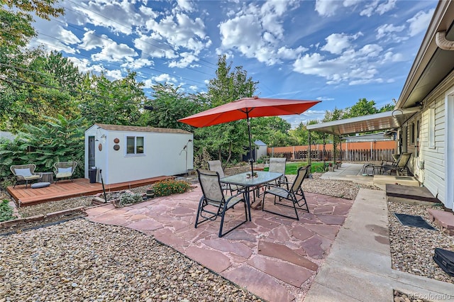 view of patio / terrace featuring an outdoor structure and a wooden deck