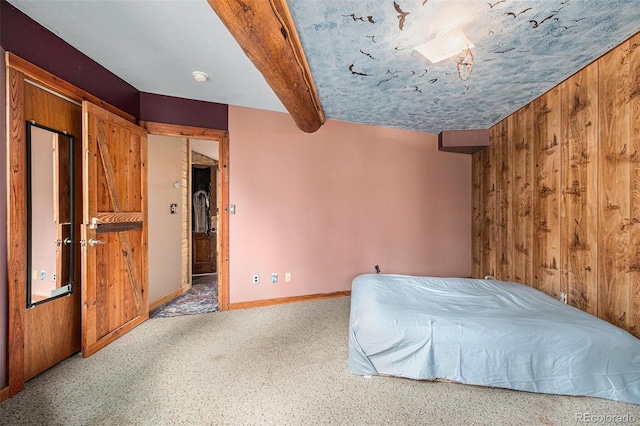 10419 Christopher Dr, Conifer, CO 80433 - unfurnished bedroom with baseboards, carpet floors, and beam ceiling