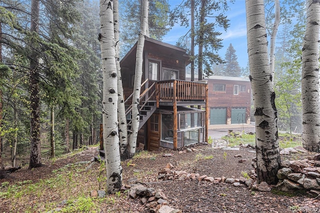 10419 Christopher Dr, Conifer, CO 80433 - back of property with a deck